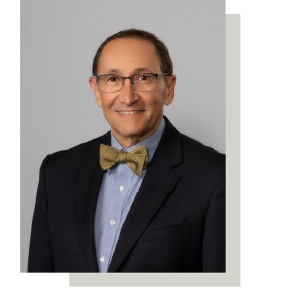 Professional headshot of Dr. Philip G. Polus, DDS, smiling warmly.